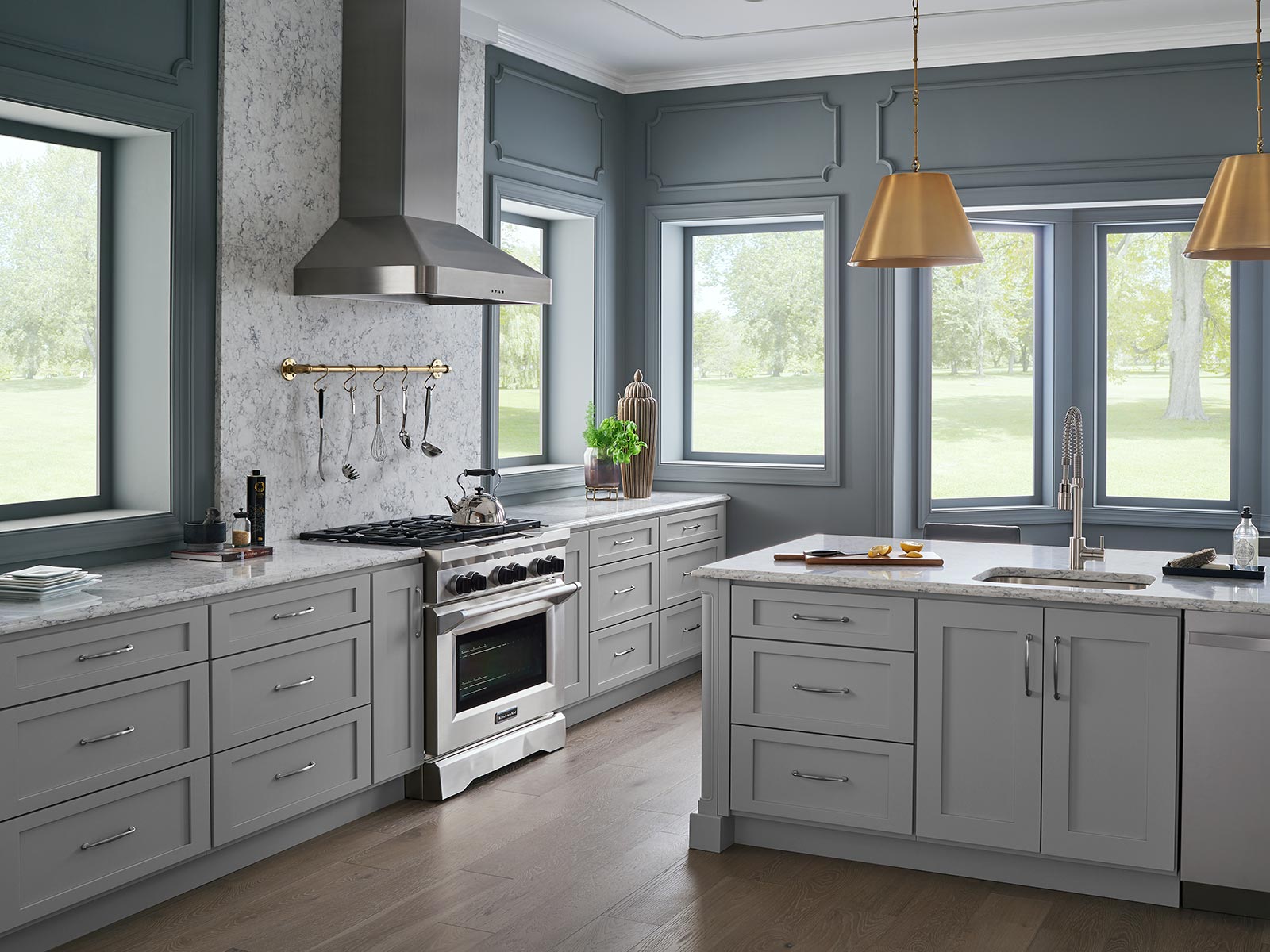 grey kitchen cabinets with gold accents