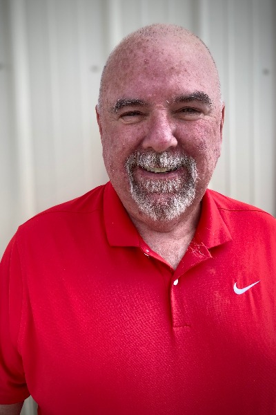 man in red shirt smiling